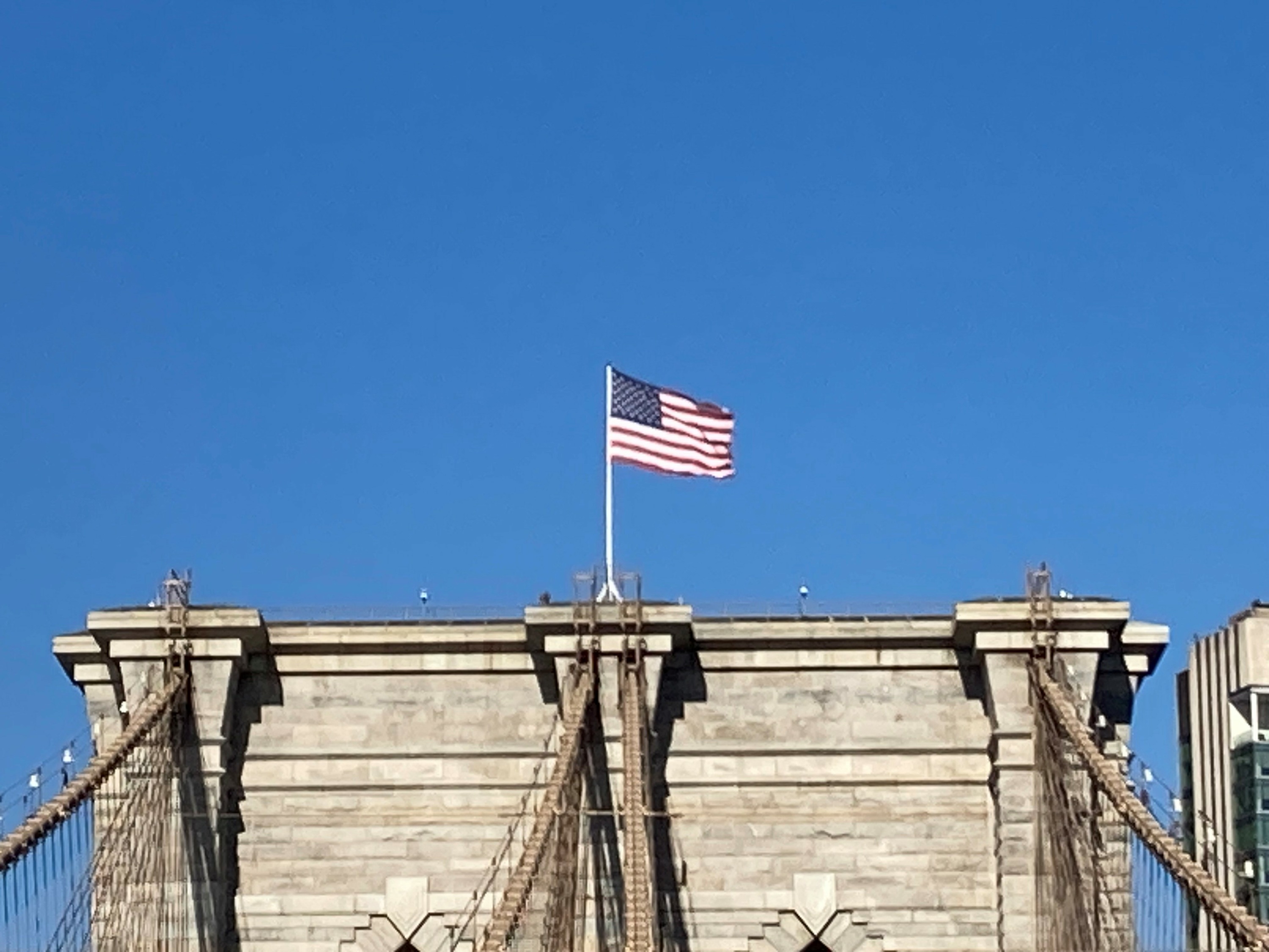US Flag over Brooklyn Bridge