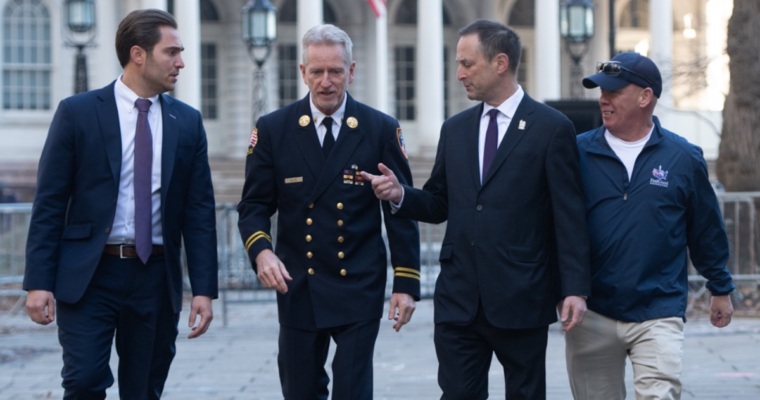 lawyers from Barasch & McGarry walk with retired firefighters